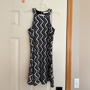 Candie’s black and silver sparkle chevron mod halter mini dress. Size XS